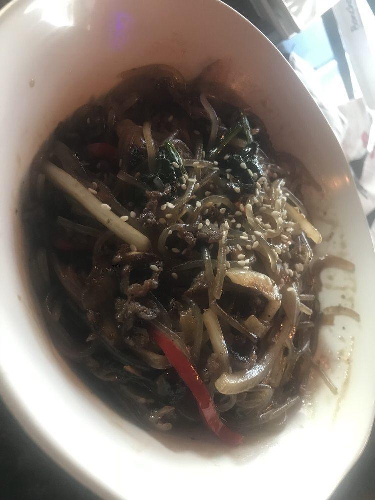 Japchae · Glass noodles, red pepper, carrots, onions, spinach, mushrooms and thinly sliced marinated beef stir-fried with Bonchon soy garlic sauce and sesame oil.