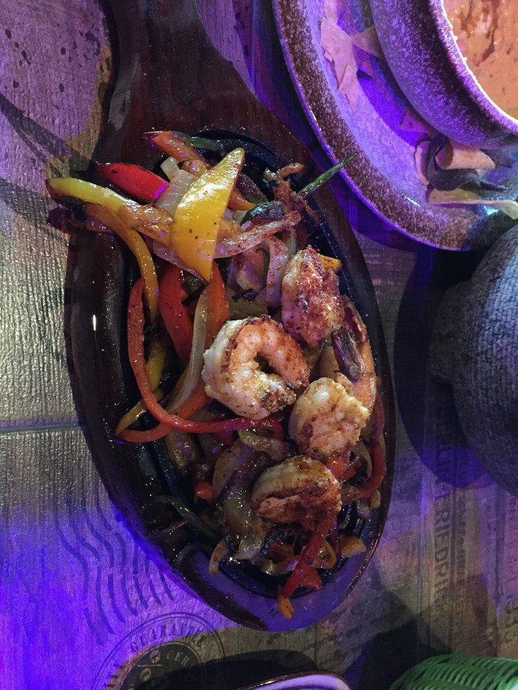 Fajitas · Our fajita peppers and onions are seasoned with our special Mexican spices and served on a sizzle platter with a side of rice, beans, and tortiilas, we add a side of guacamole, sour cream, and pico de gallo.