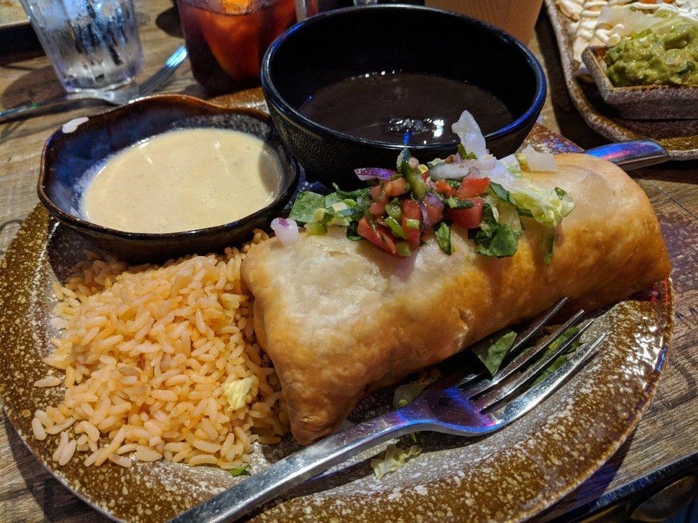 Chimichanga · Crispy fried flour tortilla, filled with cheese, black or refried beans.