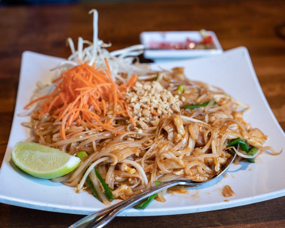 Pad Thai · Wok stir fried Thai rice noodles with egg, tofu, bean sprouts, green onions and topped with ground peanuts. Made with gluten free sauce.