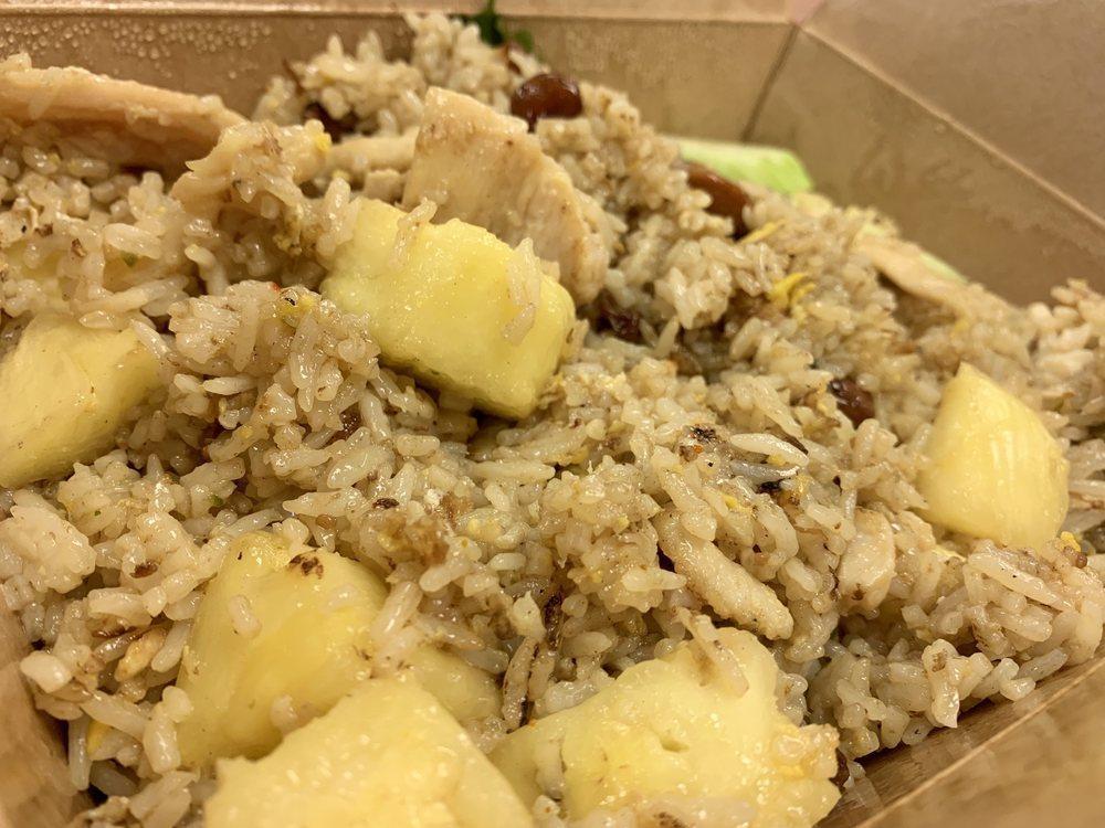 Pineapple Fried Rice · Wok fried with egg, cashew nuts, raisins and fresh pineapple.