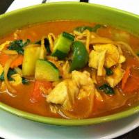 Red Curry · Medium spicy curry with bell pepper, zucchini, carrot, bamboo shoots, basil leaves in coconu...