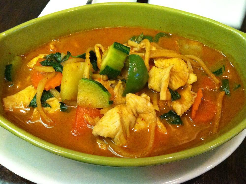 Red Curry · Medium spicy curry with bell pepper, zucchini, carrot, bamboo shoots, basil leaves in coconut milk with red curry paste. Hot and spicy.