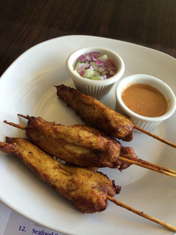 Chicken Satay · Served with cucumber relish and peanut sauce.