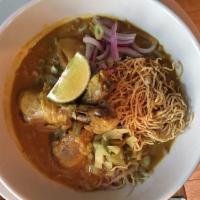 Kao Soi · Egg noodle, chicken thigh, pickled cabbage, red onion, turmeric, coconut and yellow curry.