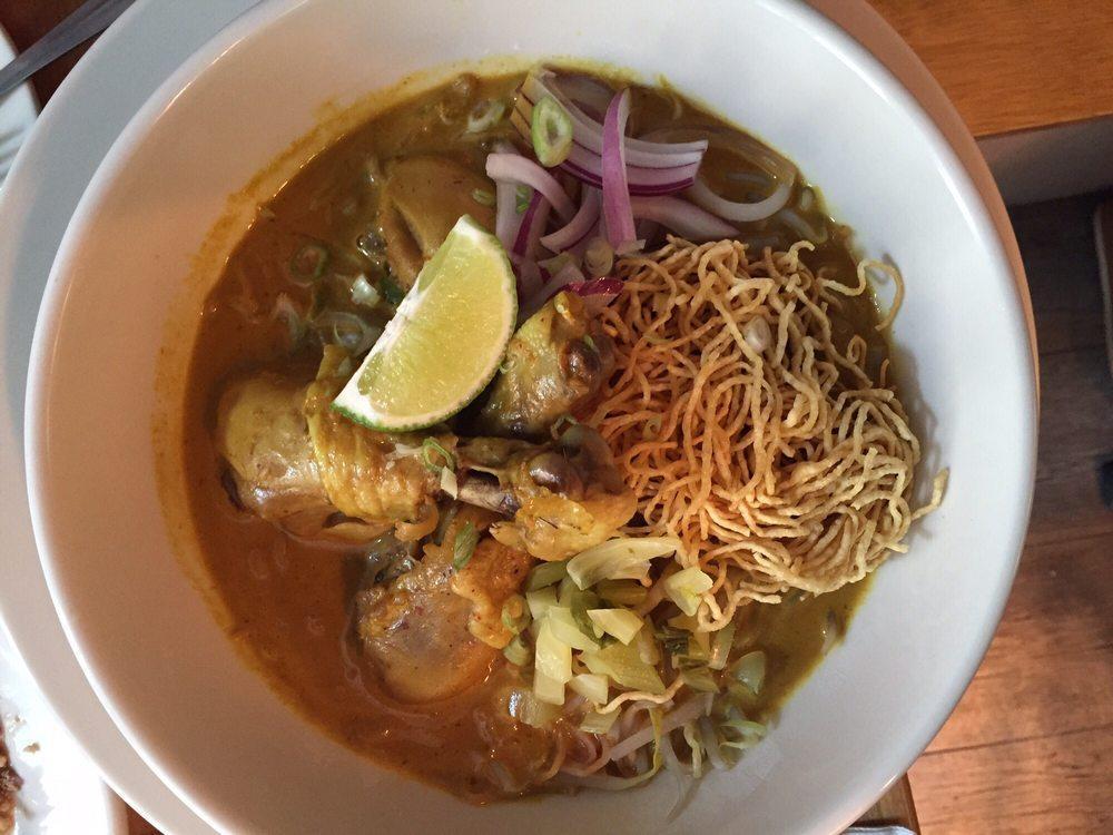 Kao Soi · Egg noodle, chicken thigh, pickled cabbage, red onion, turmeric, coconut and yellow curry.