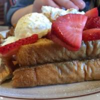 Stuffed French Toast · 4 pieces stuffed with sweetened cream cheese and topped with choice of fresh strawberries or...