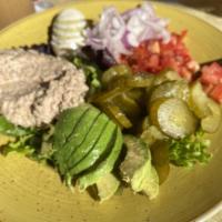 Tuna Salad · Baby mixed greens, tuna, Roma tomatoes, avocado, pickles, hard-boiled egg and red onions tos...