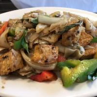 Pad Kee Mao · Drunken noodles. Pan-fried flat noodles with fresh chili-garlic, basil leaves, onions, carro...