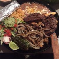 Carne Asada · Steak cooked to perfection, topped with grilled onions, mushrooms, french fries and seasoned...