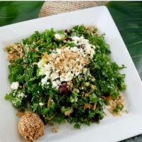 Raw Kale Salad · Hand chopped kale, cucumber, carrot, apple, craisin, housemade tahini dressing and topped wi...