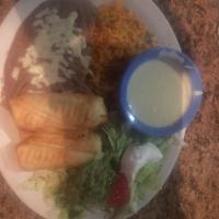 Chimichangas · 2 soft or fried flour tortilla filled with beef or chicken. Served with beans then topped wi...