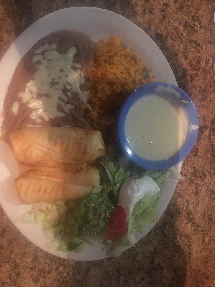 Chimichangas · 2 soft or fried flour tortilla filled with beef or chicken. Served with beans then topped with cheese dip, lettuce, tomatoes, sour cream, and guacamole.