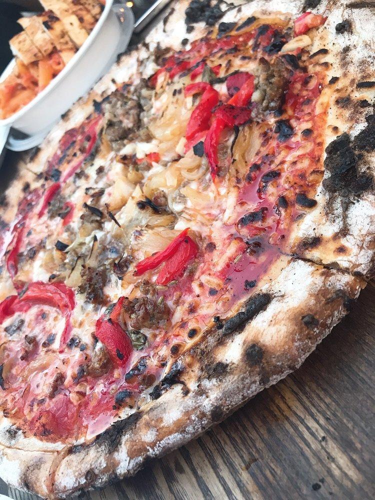 San Gennaro Pizza · Italian tomato sauce roasted red peppers, roasted onions and Italian sausage with honey picante