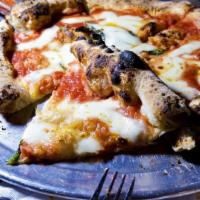 Margherita Pizza · Italian tomato sauce, fior di latte, grana Padano and basil
