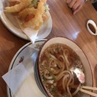 Tempura Udon · Fish cake, noodles, green onions, 1 shrimp tempura and vegetable tempura in udon broth.