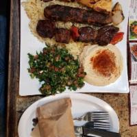 Kabob Plate · One skewer of beef and one skewer of chicken. Served with rice, hummus, your choice of fatto...