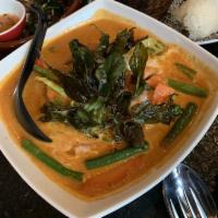 Panang Crispy Duck Curry · Mildly spiced. Crispy roasted duck in panang curry sauce, red bell, carrot, broccoli, and fr...