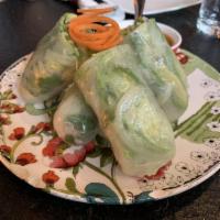 Fresh Rolls · Rice paper wrapped with iceberg lettuce, bean sprouts, mint, and cilantro. Served with sweet...