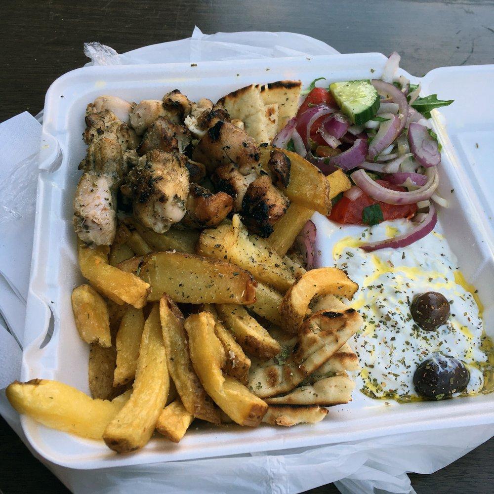 Chicken Souvlaki · Marinated and hand skewered chicken on a stick, grilled over a hardwood charcoal grill. Served with bread.