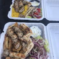 Chicken Souvlaki Platter · 2 sticks of our hand skewered chicken souvlaki over our handcut fries or yellow rice. Comes ...