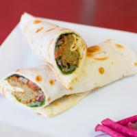 Falafel Wrap · Mixed greens, tomato, cucumber, picked sumac onions, mint, and tahini sauce. Served with tur...