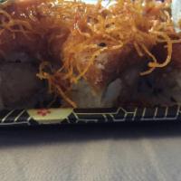 Red Dragon Roll · Shrimp tempura and cream cheese topped with spicy tuna, sweet potato, tempura, eel sauce, sp...