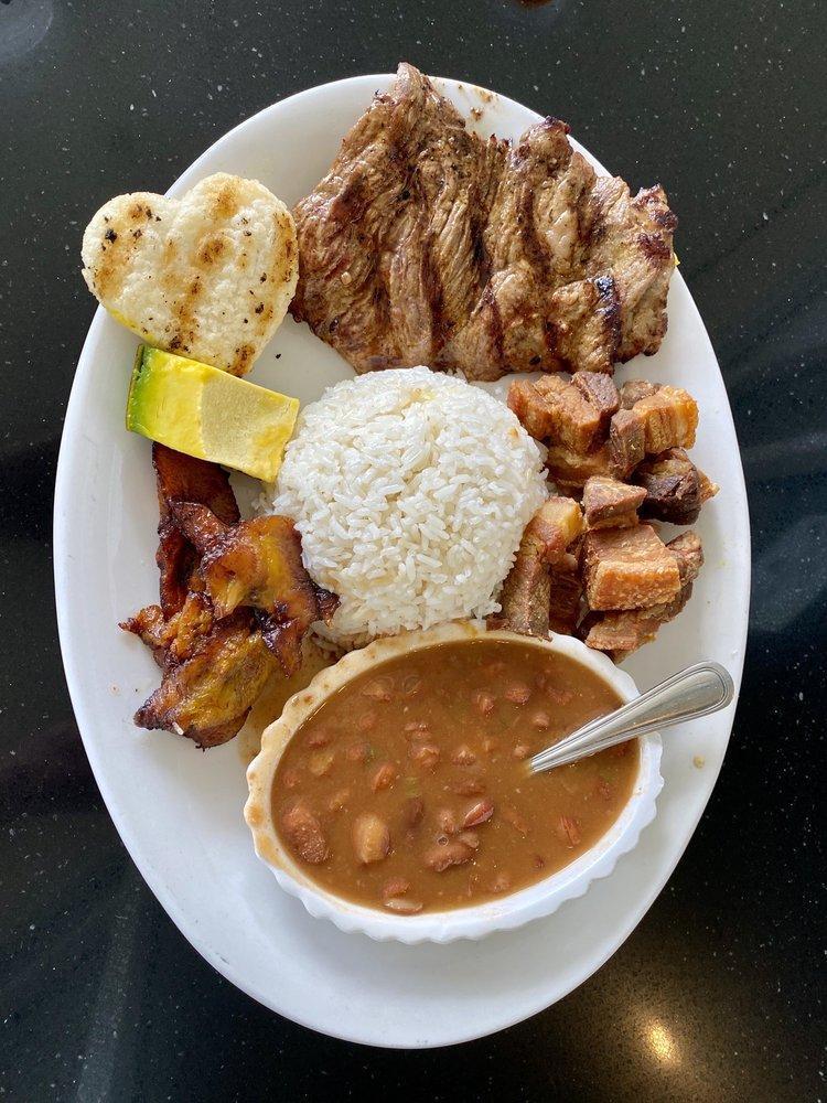 Carne Asada · Grilled beef steak. With rice, salad, and sweet plantains.