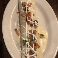 Cancun Burrito · Our famous 10” burrito stuffed with grilled chicken, chorizo, sour cream, rice and beans. To...