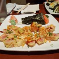 Josh W Roll · 8 pieces. Salmon, tuna and avocado wrapped with soybean paper and lightly fried, topped with...