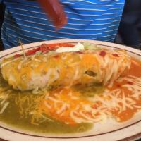 Shrimp Wet Burrito · A large flour tortilla stuffed with rice, beans, delicious shrimp, and topped with creamy sa...