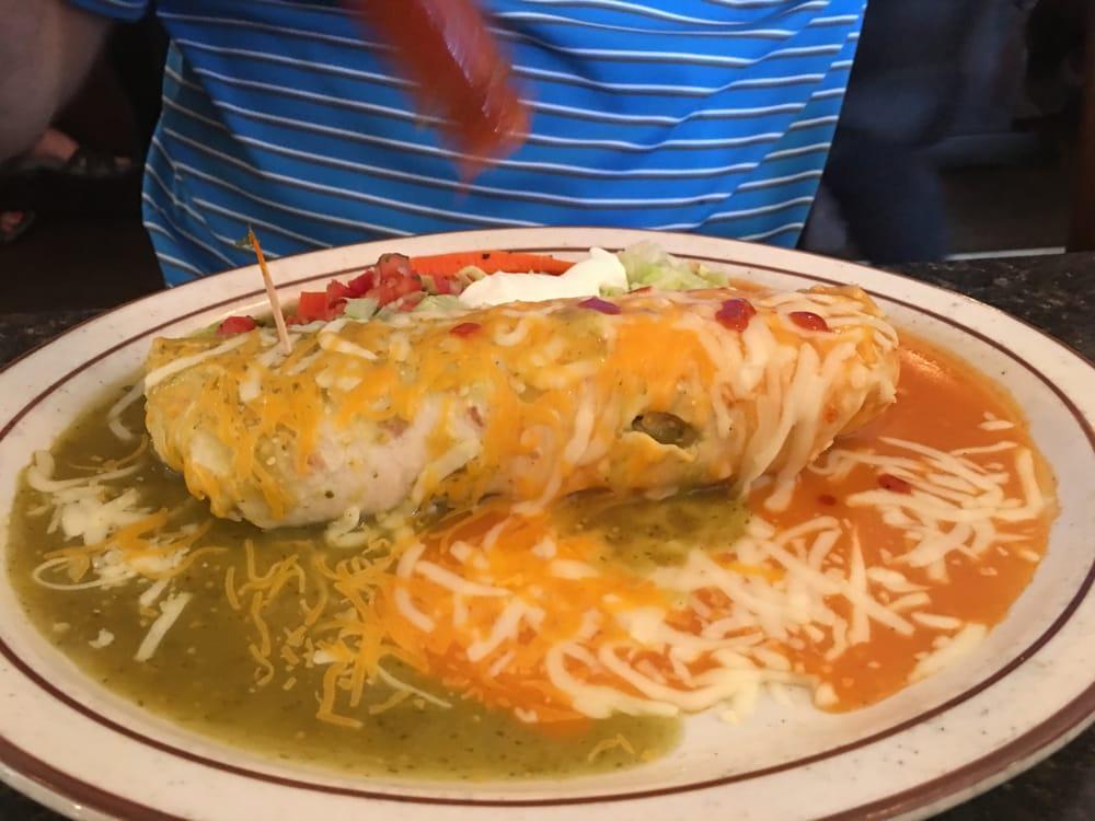 Shrimp Wet Burrito · A large flour tortilla stuffed with rice, beans, delicious shrimp, and topped with creamy sauce and melted cheese.
