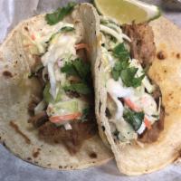 Street Tacos · Slow smoked Pulled Pork, Coleslaw, Cilantro and Lime on 3 Local Made Corn Tortillas.