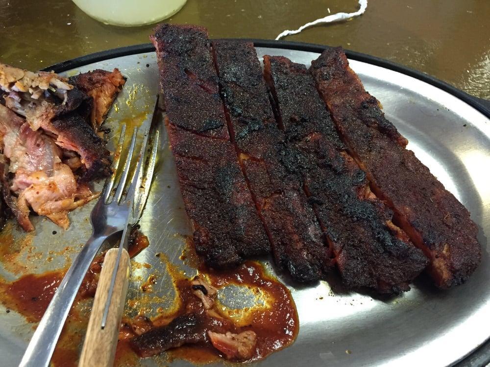 Half Rack · Half Rack of Dry Rubbed Baby Back Ribs, House Made BBQ Sauce on Side.