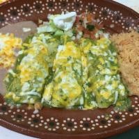 Enchiladas Verdes · Chicken enchiladas and topped with salsa verde.