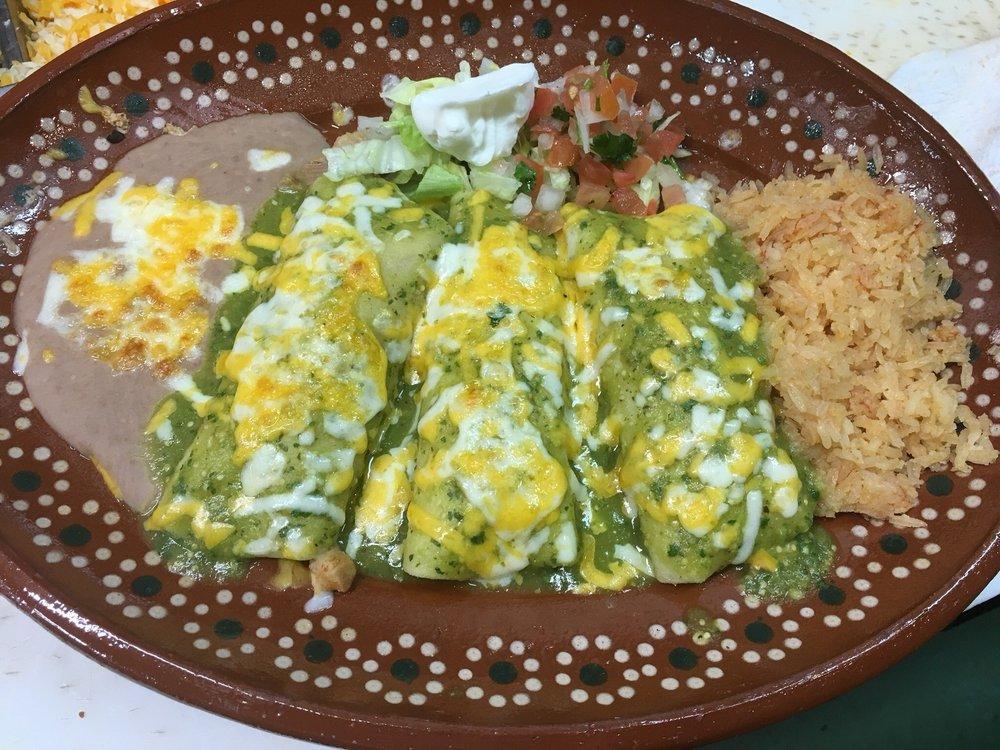 Enchiladas Verdes · Chicken enchiladas and topped with salsa verde.