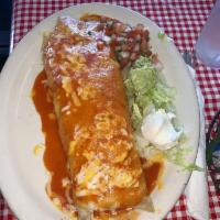 Giant Burrito · Largest burrito filled with meat, rice beans, cheese topped with sauce and cheese. Enough fo...
