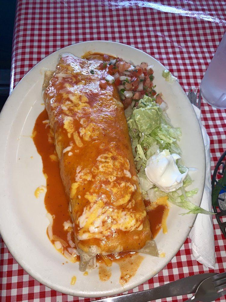 Giant Burrito · Largest burrito filled with meat, rice beans, cheese topped with sauce and cheese. Enough for 2.