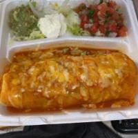 Enchilada Style Burrito · Maria's favorite burrito topped with enchilada sauce and melted cheese.