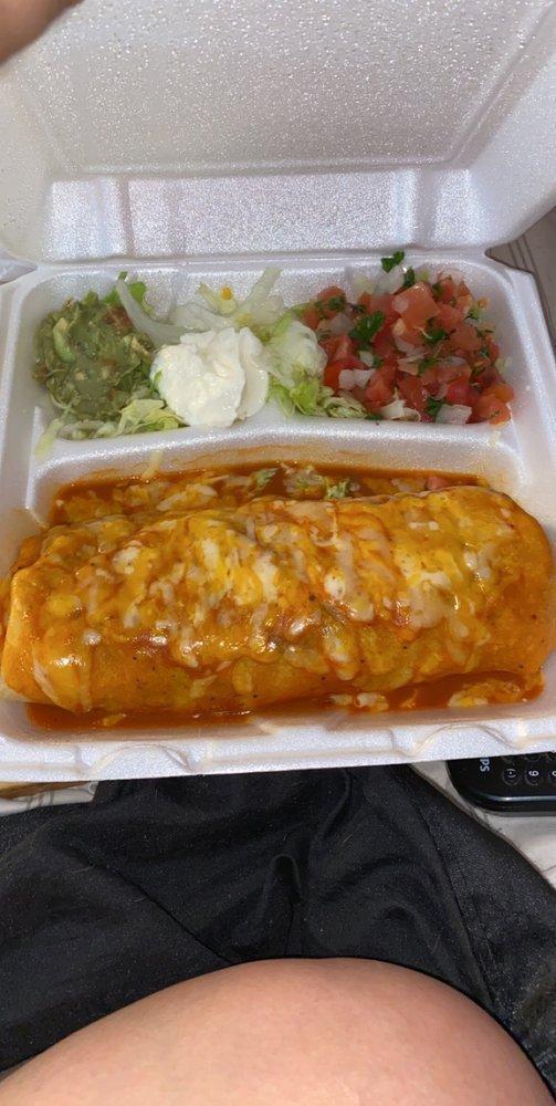 Enchilada Style Burrito · Maria's favorite burrito topped with enchilada sauce and melted cheese.