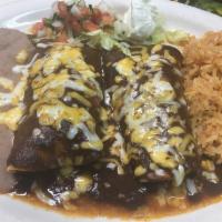 Enchiladas Guadalajara · 2 cheesy enchiladas filled with chicken and topped with a tradition Mexican mole.