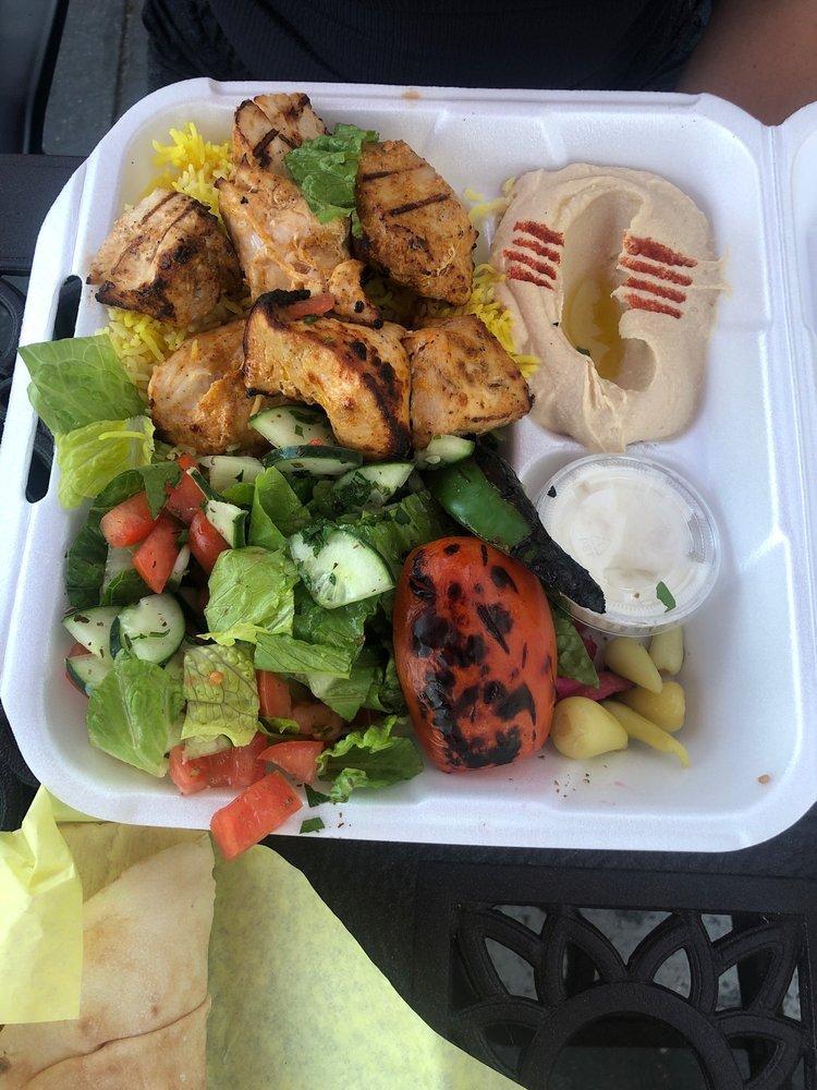 Chicken Kabob Plate · Cubed skinless chicken breast marinated in fresh garlic, our special spices and olive oil, skewered and grilled. Served with hummus, pickles, small house salad, rice, 2 pita bread, grilled tomato and jalapeno.