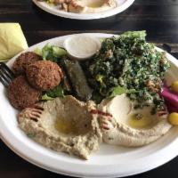 Vegetarian Plate · Hummus, baba ghanoush, tabbouleh, 2 pieces of falafel, 2 pieces of stuffed grape leaves (dol...