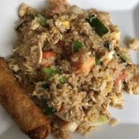 Thai Fried Rice · Traditional Thai fried rice with scallions, onions, tomatoes and eggs.