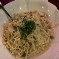 Seafood Pasta · Prawns, fresh fish, calamari, tomatoes and capers in a chardonnay cream sauce.