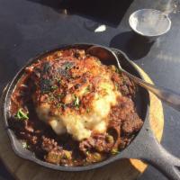 Shepherd's Pie · Red wine braised beef, wild mushrooms, root vegetables, demi-glace, mashed potato crust and ...