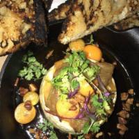 Cast Iron Baked Brie · caramalized red onion, poached apples, bourbon-honey butter, grilled Iggy's focaccia