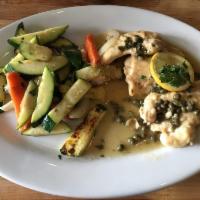 Chicken Piccata · Tender breast of chicken sauteed in lemon butter, white wine and capers, served with linguin...