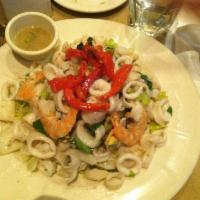 Seafood Salad · Shrimp, calamari, mussels, sea scallops, roasted red peppers, celery, garlic, basil, olive o...