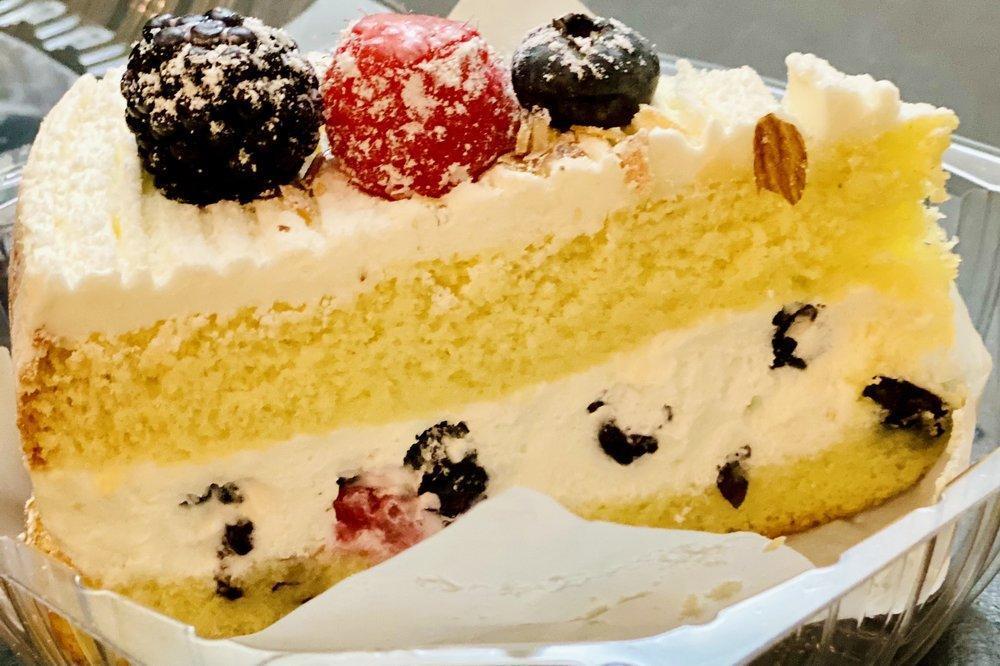 Gateau Triple Berry · Sponge cake, blackberry, blueberry, raspberry, whipped cream and almond.